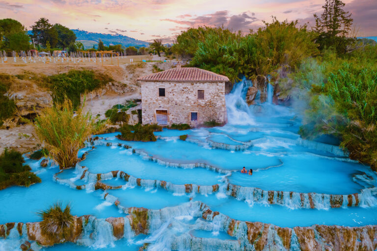 Toscane Italy, a natural spa with waterfalls and hot springs at Saturnia Thermal Baths, Tuscany, Italy. couple on vacation in Saturnia Tuscany visit Natural hot springs thermal waterfalls